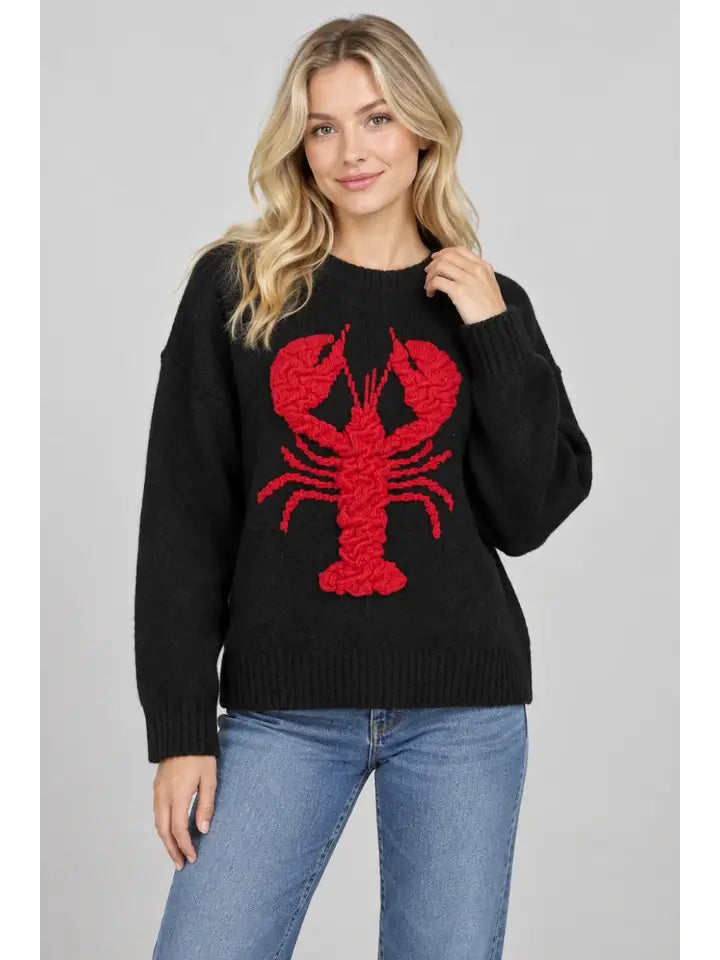 Black long-sleeve knit sweater with a large textured red lobster on the front and ribbed cuffs and hem