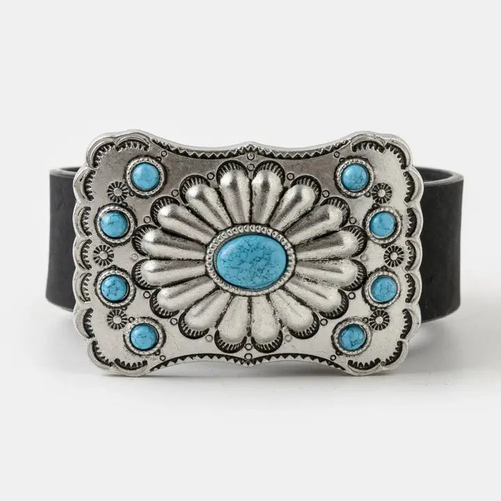 Black faux suede Western belt with a silver-tone floral buckle and turquoise-colored accents