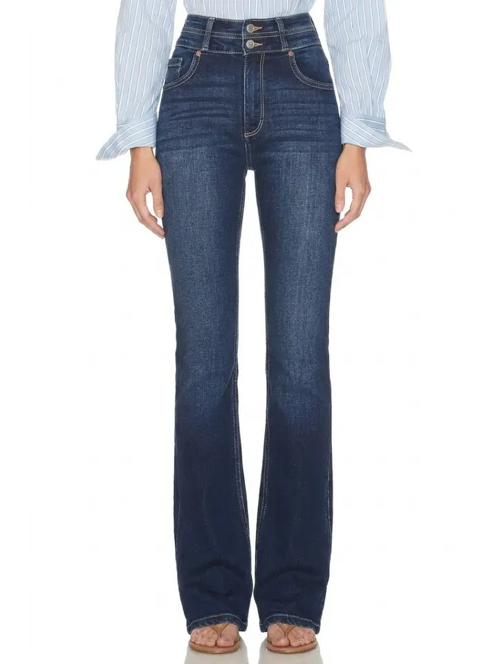 Dark stone wash high-rise bootcut jeans with a double-button waistband, styled with a striped blouse