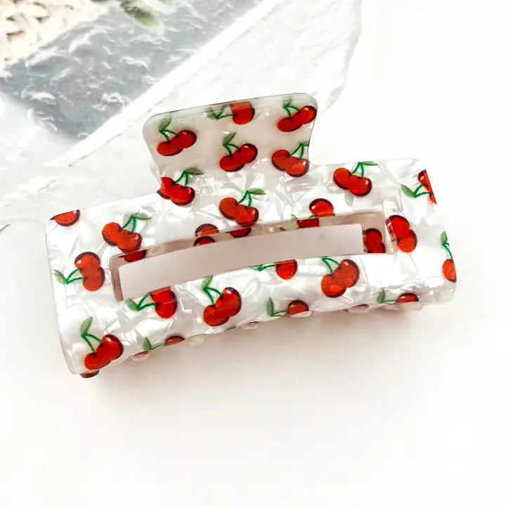 Hollow Square Cherry Print Claw Clip in pearlescent white acetate with all-over red cherry and green stem print