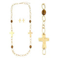 Gold-tone cross chain set with necklace, bracelet, and cross stud earrings featuring tiger's eye stones