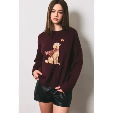 Burgundy long-sleeve sweater with a golden dog motif wearing a striped scarf