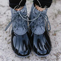 Grey quilted lace-up duck boots with glossy dark rounded toes