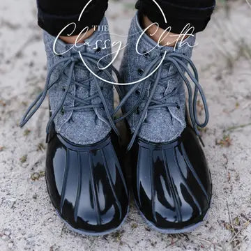 Grey quilted lace-up duck boots with glossy dark rounded toes