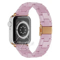 Lavender linked Apple Watch band with a gold-tone clasp and connector accents, shown on a watch