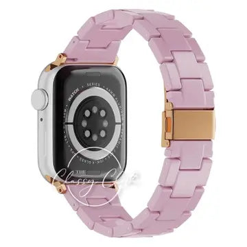 Lavender linked Apple Watch band with a gold-tone clasp and connector accents, shown on a watch