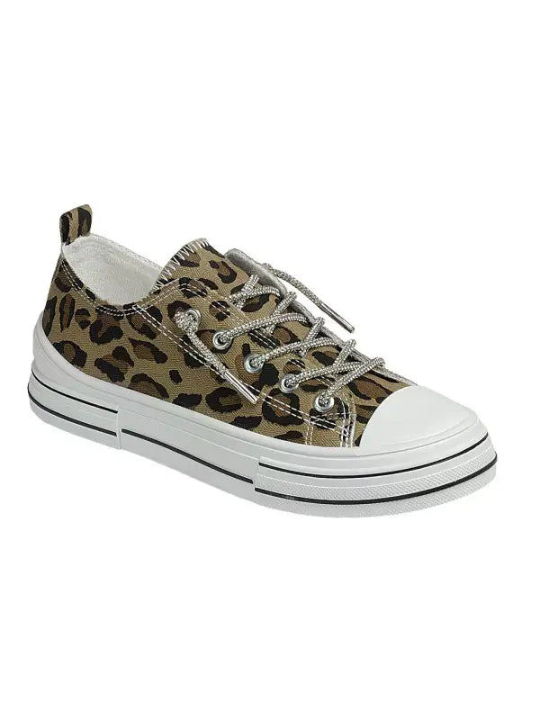 Leopard-print low-top canvas sneaker with shimmering dazzle laces, a white toe cap, and a striped white sole