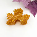 Golden Maple Claw Clip in warm amber honey acetate shaped like three maple leaves with raised gold vein detailing