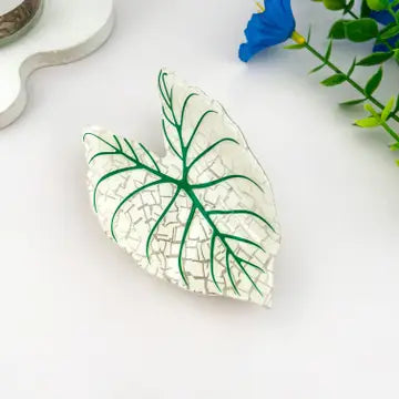 Monstera white leaf claw clip with pearlescent white body and deep green vein detailing