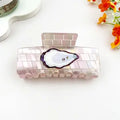 Oyster claw clip with pearlescent blush tile body and oyster shell with pearl centerpiece