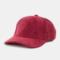Cranberry corduroy trucker hat with a curved brim and ribbed texture