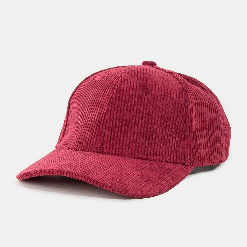 Cranberry corduroy trucker hat with a curved brim and ribbed texture