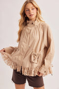 Beige button down jacket with ruffled lace hem, stand collar, and front drawstring patch pockets.
