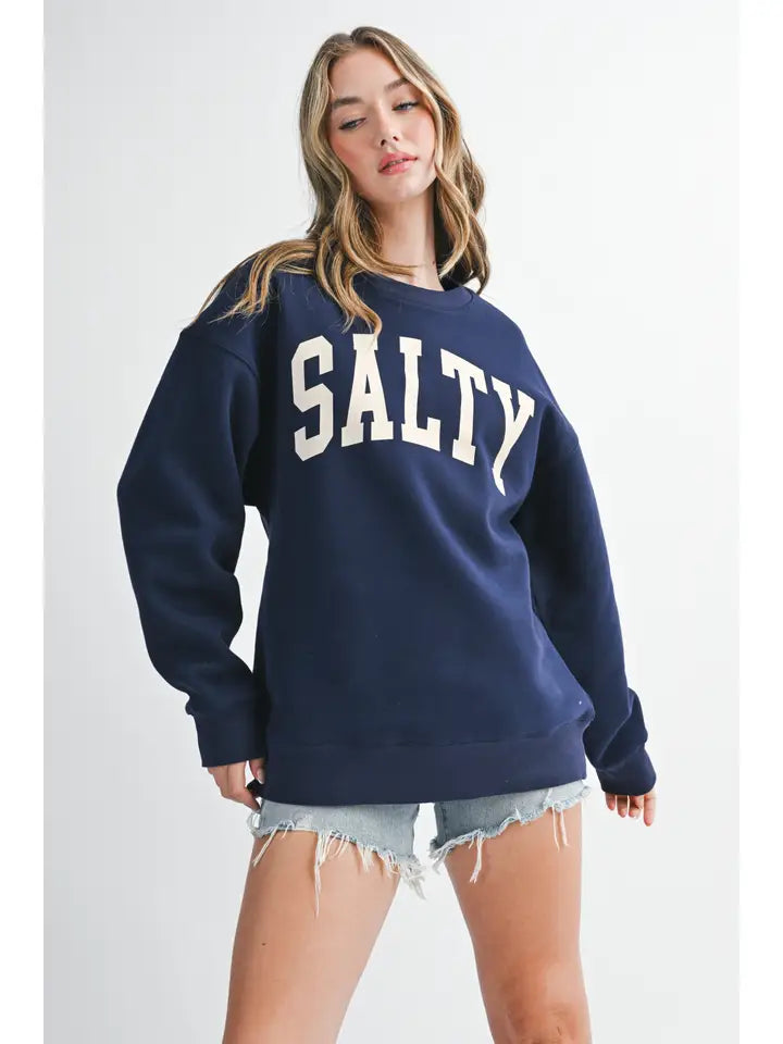 Navy Salty graphic pullover sweatshirt with cream block lettering, crew neckline, and ribbed cuffs and hem