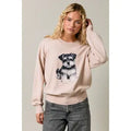 Pale neutral long-sleeve sweater with a black-and-gray schnauzer motif, round neckline, and ribbed cuffs and hem