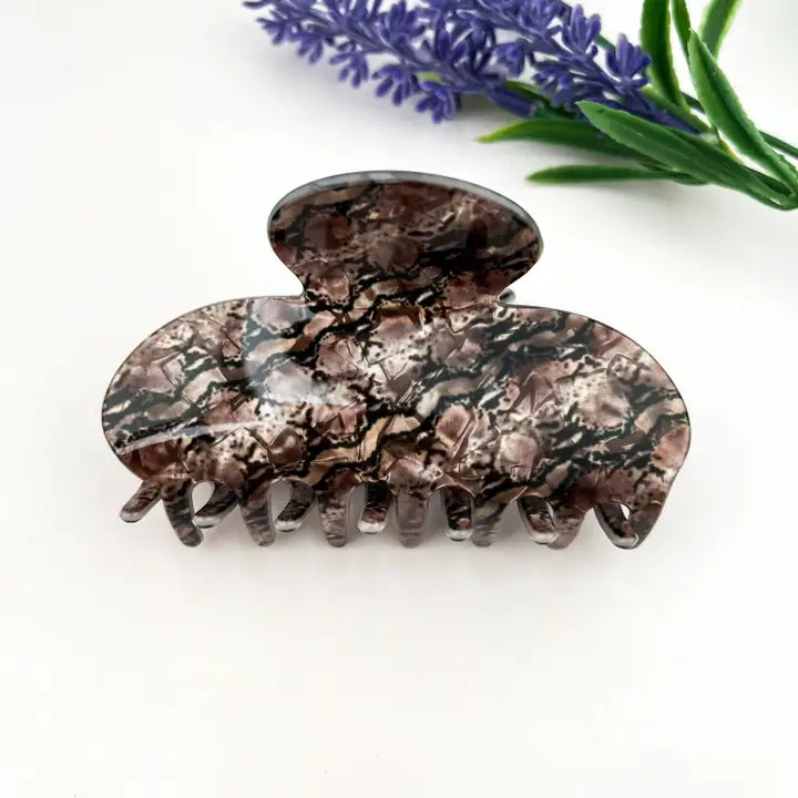 Snake Print Claw Clip in oversized acetate with smoky brown, taupe, and grey python snake skin texture print