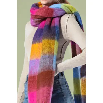 Model wearing a colorful checkered scarf in pink, purple, blue, green, and yellow