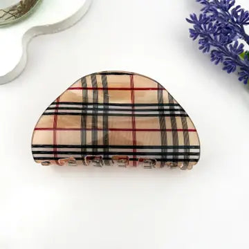 Vintage Plaid Claw Clip in pearlescent acetate with classic tartan plaid pattern in camel, black, red, and teal on half-moon silhouette