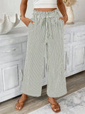 Black and cream pinstripe wide-leg trousers with paperbag waist and tie detail