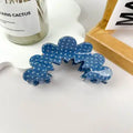 Wavy Blue Denim Claw Clip in scalloped cloud wave silhouette in denim blue acetate with white polka dot pattern and silver hardware