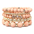 5-piece blush pink wood bead stackable bracelet set with gold stardust beads and crystal accent