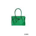 Kelly green jelly firkin bag with dual top handles and silver lock clasp detail on white background