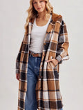 Longline caramel, cream, brown, and charcoal plaid hooded shacket with front buttons and pockets, styled with jeans.