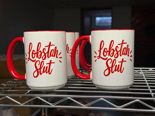 White ceramic mug with red handle and interior, bold red Lobstah Slut script on front
