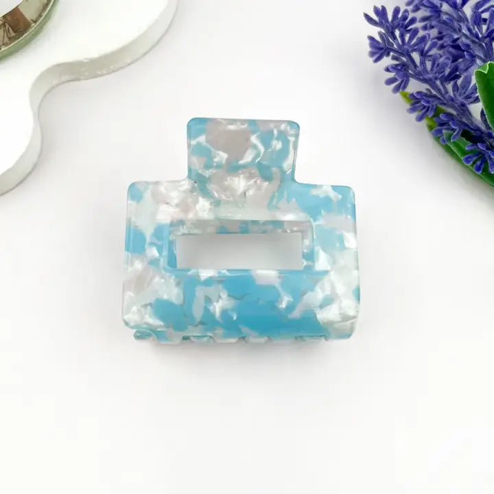 Blue Marble Hollow Square Claw Clip in soft sky blue and pearl white marble acetate with geometric hollow square silhouette