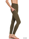 Dark olive high-rise leggings with a wide waistband and side pocket, shown on a model