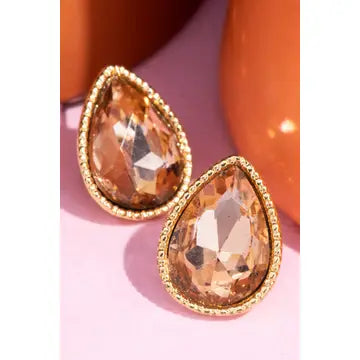 Faceted peach-colored teardrop stud earrings with textured gold-tone borders