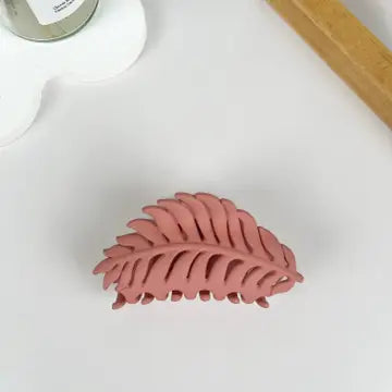 Pink Leaf Claw Clip in matte dusty rose with fern leaf silhouette and open cutout detailing