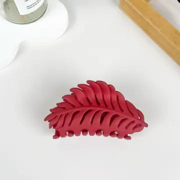 Red Leaf Claw Clip in matte cranberry red with fern leaf silhouette and open cutout detailing