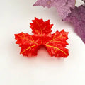 Red Maple Claw Clip in vivid scarlet red acetate shaped like three maple leaves with raised gold vein detailing