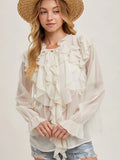 Ivory chiffon blouse with cascading front ruffles, sheer long sleeves, and flared cuffs.