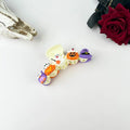 Witchy Pumpkin Party Claw Clip with raised 3D ghost, orange jack-o-lantern, and purple witch hat charms on cream base