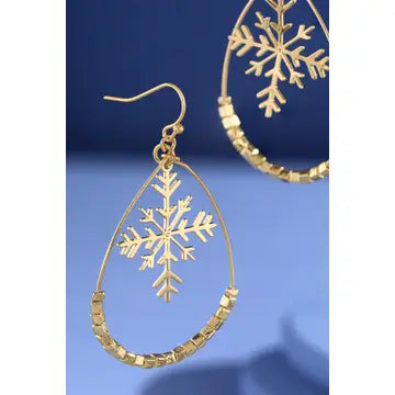 Gold-tone open teardrop earrings with dangling snowflake charms and decorative accents along the lower edge