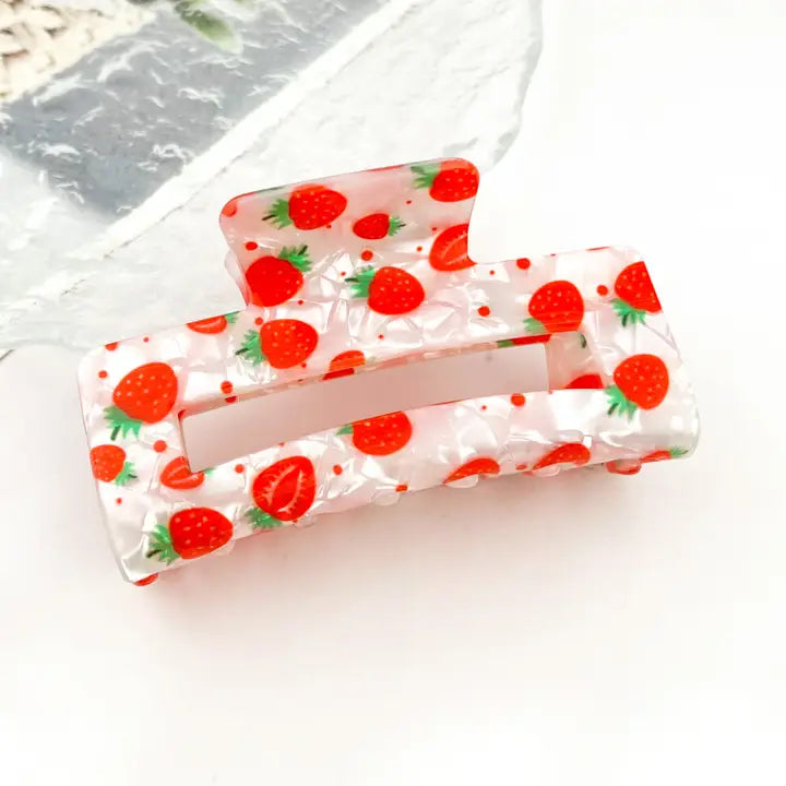 Hollow Square Strawberry Print Claw Clip in pearlescent blush acetate with all-over red strawberry print