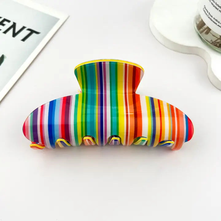 Colorful Stripes Claw Clip with bold rainbow vertical stripe pattern in red, orange, yellow, green, blue, and purple