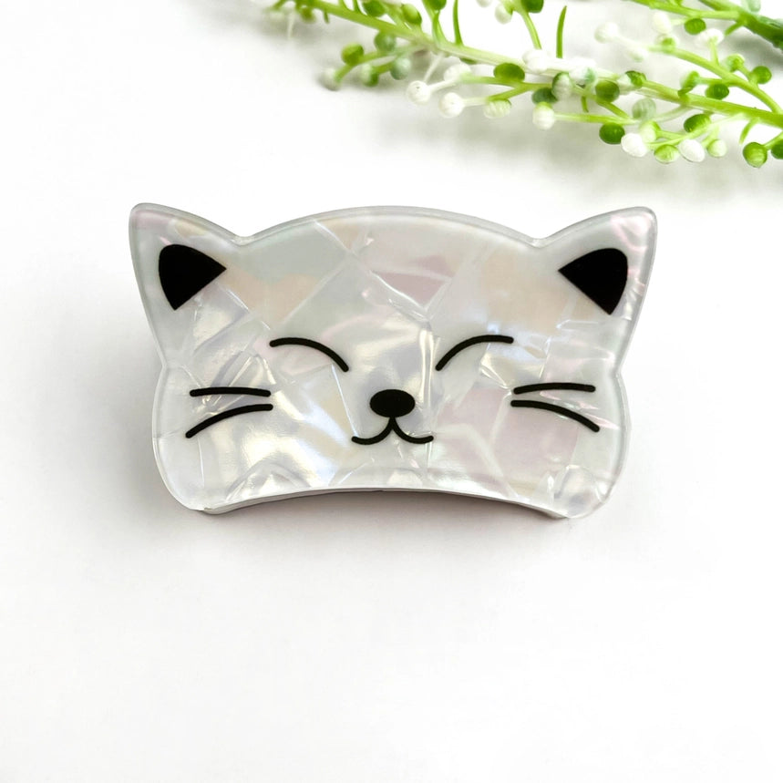 White Cat Claw Clip in pearlescent iridescent shell-effect finish with black whisker and ear details
